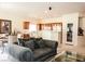 A cozy living room showcasing an open layout connecting to the kitchen and dining area at 5845 Swan Point Pl, Las Vegas, NV 89122