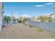 Low maintenance backyard with gravel landscaping, a wall, and metal fencing at 600 Baysville Ct, Las Vegas, NV 89144