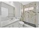 Bathroom featuring modern stone shower, white cabinets, countertop and ample light at 600 Baysville Ct, Las Vegas, NV 89144