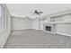 Open-concept living room featuring a fireplace, recessed lighting, and gray flooring at 600 Baysville Ct, Las Vegas, NV 89144