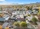 Aerial view of neighborhood with mature trees, well-kept homes, garages, and convenient street access at 620 Avenue H, Boulder City, NV 89005