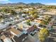 Stunning aerial view of charming neighborhood with mountain views, mature landscaping and well-maintained homes at 620 Avenue H, Boulder City, NV 89005