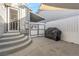 Private backyard with covered barbecue area, accessible from the house through gray cement steps, perfect for outdoor gatherings at 620 Avenue H, Boulder City, NV 89005