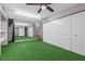 Finished basement area featuring mirrored wall, ceiling fan, and closet space at 620 Avenue H, Boulder City, NV 89005