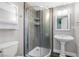 Modern bathroom featuring a glass-door shower and pedestal sink at 620 Avenue H, Boulder City, NV 89005