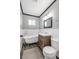 Bathroom features vintage tub, modern vanity, and sleek gray tile at 620 Avenue H, Boulder City, NV 89005
