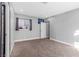 Clean bedroom with neutral carpet, bright window, and freshly painted walls at 620 Avenue H, Boulder City, NV 89005