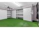 Spacious bedroom featuring bright green carpet and large, built-in closets at 620 Avenue H, Boulder City, NV 89005