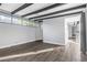 Bright room with modern design including hardwood floors and decorative ceiling beams at 620 Avenue H, Boulder City, NV 89005