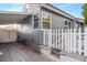 Charming exterior features gray siding, brick foundation, and covered carport at 620 Avenue H, Boulder City, NV 89005