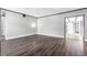 Open-concept living area with hardwood floors, white walls and recessed lighting at 620 Avenue H, Boulder City, NV 89005