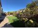 Lush backyard with a combination of patio space and synthetic grass for easy maintenance at 6277 Mustang Spring Ave, Las Vegas, NV 89139