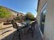 Cozy backyard with paver patio, dining set, and lush landscaping for outdoor enjoyment at 6277 Mustang Spring Ave, Las Vegas, NV 89139