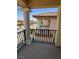 Balcony with wrought iron railing and columns showcasing neighborhood views at 6277 Mustang Spring Ave, Las Vegas, NV 89139