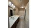 Bathroom featuring a double vanity, tile flooring, and combined shower and bathtub at 6277 Mustang Spring Ave, Las Vegas, NV 89139