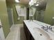 Bathroom with double sinks, walk-in shower, and ample lighting at 6277 Mustang Spring Ave, Las Vegas, NV 89139