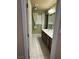 Well-lit bathroom with double vanity, tile floor, and a window with natural light at 6277 Mustang Spring Ave, Las Vegas, NV 89139
