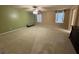 Large bedroom featuring neutral carpet, soothing wall colors, and multiple windows for plenty of natural light at 6277 Mustang Spring Ave, Las Vegas, NV 89139