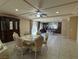 Formal dining area with tile flooring, stylish lighting, and kitchen view at 6277 Mustang Spring Ave, Las Vegas, NV 89139