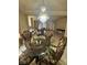 Formal dining room showcasing chandelier, table, and entry to living room at 6277 Mustang Spring Ave, Las Vegas, NV 89139