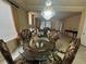 Formal dining room showcasing chandelier, table, and entry to living room at 6277 Mustang Spring Ave, Las Vegas, NV 89139