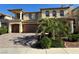 Beautiful two-story home with a tile roof, balcony, manicured landscaping, and a spacious three-car garage at 6277 Mustang Spring Ave, Las Vegas, NV 89139