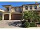 Stunning two-story home with a tile roof, balcony, manicured landscaping, and a spacious three-car garage at 6277 Mustang Spring Ave, Las Vegas, NV 89139