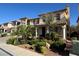 Charming two-story home featuring a tiled roof, balcony, and lush landscaping adding curb appeal at 6277 Mustang Spring Ave, Las Vegas, NV 89139