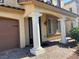 Inviting entrance featuring elegant pillars and manicured landscaping, leading to a cozy home at 6277 Mustang Spring Ave, Las Vegas, NV 89139