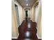 Charming hallway with sleek flooring, neutral paint, and arched doorways, offering a glimpse into the well-designed layout at 6277 Mustang Spring Ave, Las Vegas, NV 89139