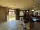 Well-lit kitchen featuring dark wood cabinets, granite countertops, and stainless steel appliances at 6277 Mustang Spring Ave, Las Vegas, NV 89139