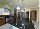 Well-equipped kitchen features granite island and stainless-steel appliances at 6277 Mustang Spring Ave, Las Vegas, NV 89139