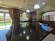 Spacious kitchen features a granite island and stainless-steel appliances at 6277 Mustang Spring Ave, Las Vegas, NV 89139