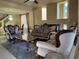 Formal living room featuring ornate furniture, fireplace and abundant natural light at 6277 Mustang Spring Ave, Las Vegas, NV 89139