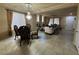 Spacious living room with tile floors, a fireplace, and a large window for natural light at 6277 Mustang Spring Ave, Las Vegas, NV 89139