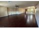 Expansive living room showcasing dark wood floors and an open layout, perfect for entertaining guests or relaxing at 6277 Mustang Spring Ave, Las Vegas, NV 89139