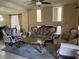 Formal living room featuring ornate furniture, fireplace and abundant natural light at 6277 Mustang Spring Ave, Las Vegas, NV 89139