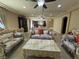 Bright living room with elegant seating and views into kitchen at 6277 Mustang Spring Ave, Las Vegas, NV 89139