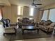 Formal living room featuring ornate furniture, fireplace and abundant natural light at 6277 Mustang Spring Ave, Las Vegas, NV 89139