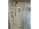Shower features chrome fixtures with textured wall surround and glass door at 6277 Mustang Spring Ave, Las Vegas, NV 89139