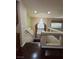 Upstairs landing showcasing a chandelier, decorative window treatments, and wood flooring at 6277 Mustang Spring Ave, Las Vegas, NV 89139