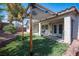 Backyard featuring artificial turf, rock landscaping, covered patio and privacy wall at 6333 Sterling Ranch Way, North Las Vegas, NV 89081