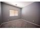 Cozy bedroom with carpet flooring and natural light from a window at 6333 Sterling Ranch Way, North Las Vegas, NV 89081