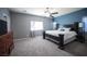 Spacious bedroom with carpet, ceiling fan, and traditional-style furniture and decor at 6333 Sterling Ranch Way, North Las Vegas, NV 89081