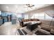 Inviting living room with a ceiling fan and comfortable seating area connected to the kitchen at 6333 Sterling Ranch Way, North Las Vegas, NV 89081