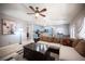 Inviting living room with a ceiling fan and comfortable seating area connected to the kitchen at 6333 Sterling Ranch Way, North Las Vegas, NV 89081