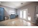 Bright sunroom with French doors, custom cabinets, and a cozy pet door for added convenience at 6333 Sterling Ranch Way, North Las Vegas, NV 89081