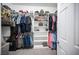 Walk-in closet with built-in shelves and hanging racks to keep clothes and accessories organized at 6333 Sterling Ranch Way, North Las Vegas, NV 89081