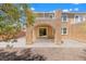 Spacious backyard featuring a covered patio, low-maintenance landscaping, and a stucco wall at 6636 Surfbird St, North Las Vegas, NV 89084
