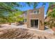 Stunning two-story home with a covered patio, balconies, and a landscaped backyard area at 6636 Surfbird St, North Las Vegas, NV 89084